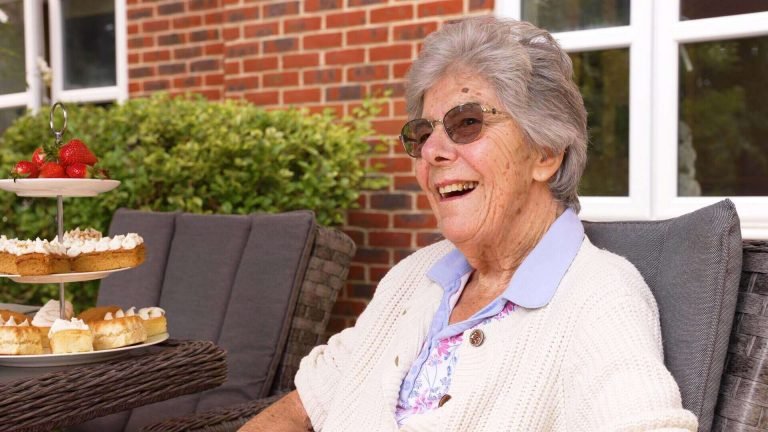 Family chatting with relative about living in care