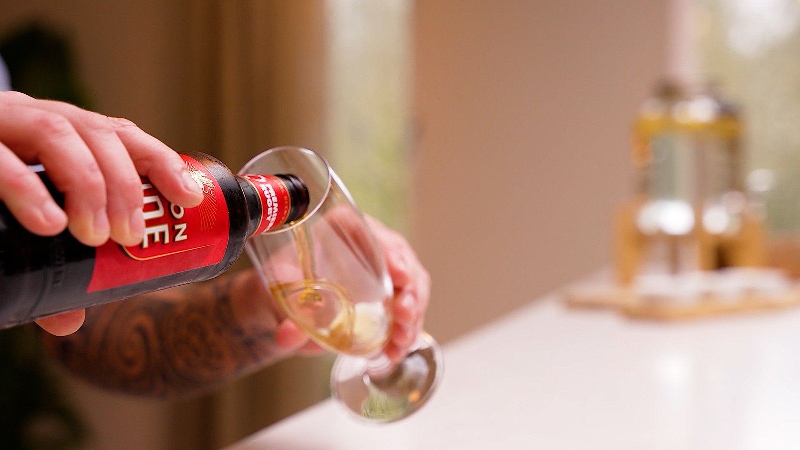 Beer pouring into glass bar